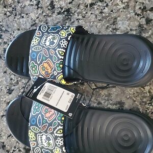 Brand new Under Armour slides M-9, W-10.5
